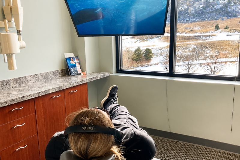 TV with Noise Canceling Headphones in Littleton